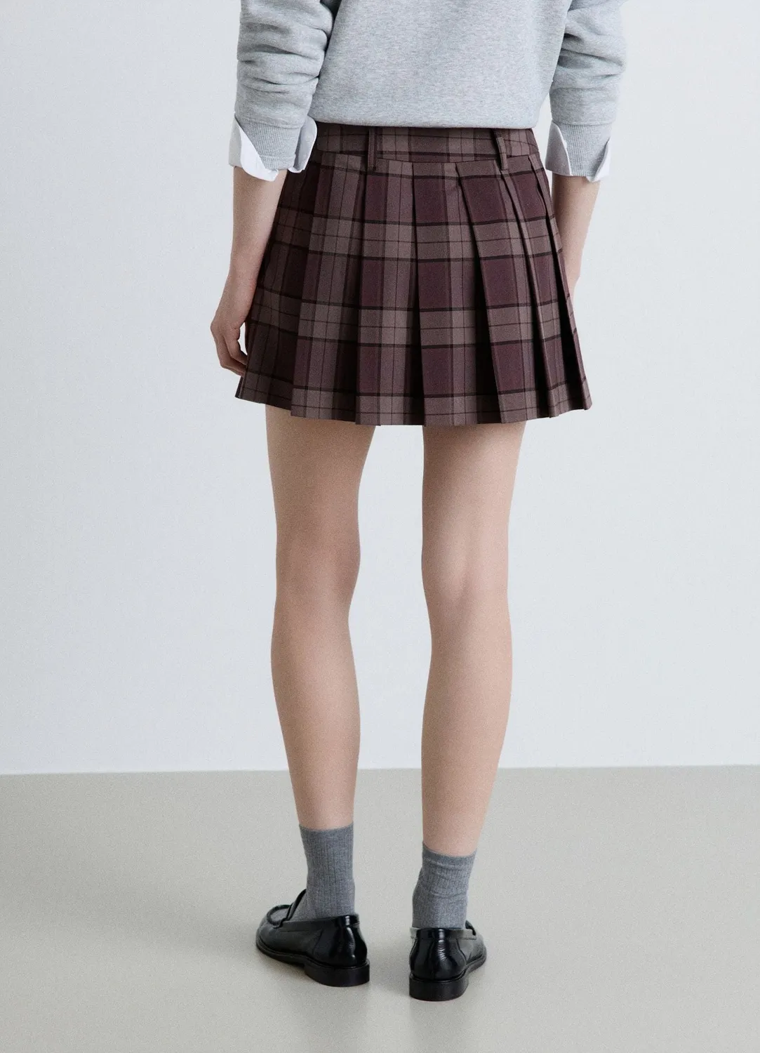Calliope jupe-short à carreaux plissée femme