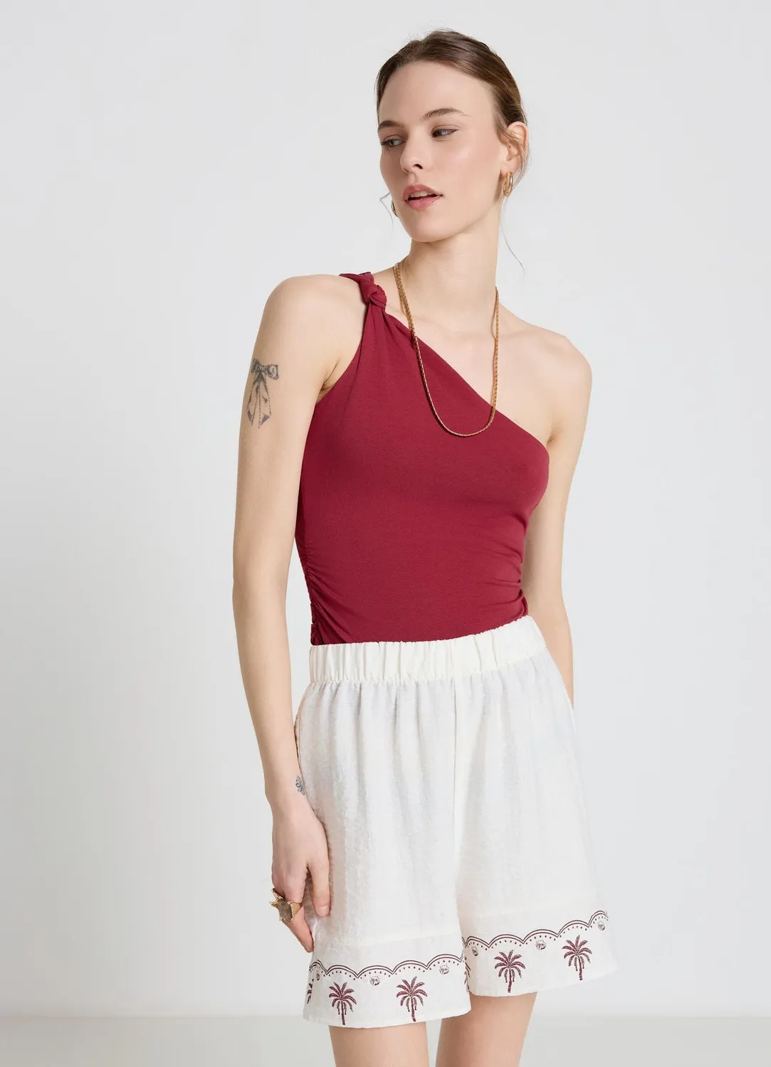 Calliope top mono-épaule nœud femme uni