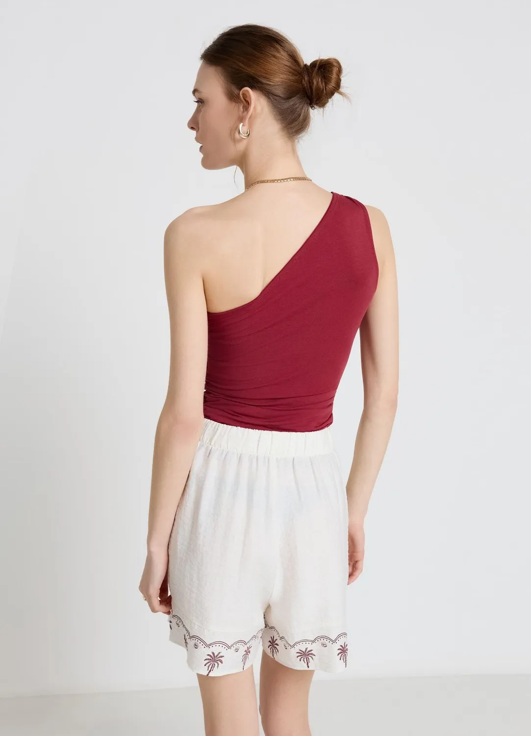 Calliope top mono-épaule nœud femme uni