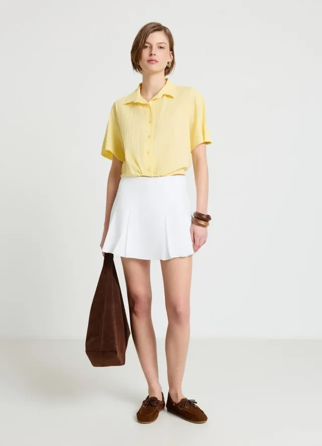 Calliope chemise relief unie manches courtes blousante