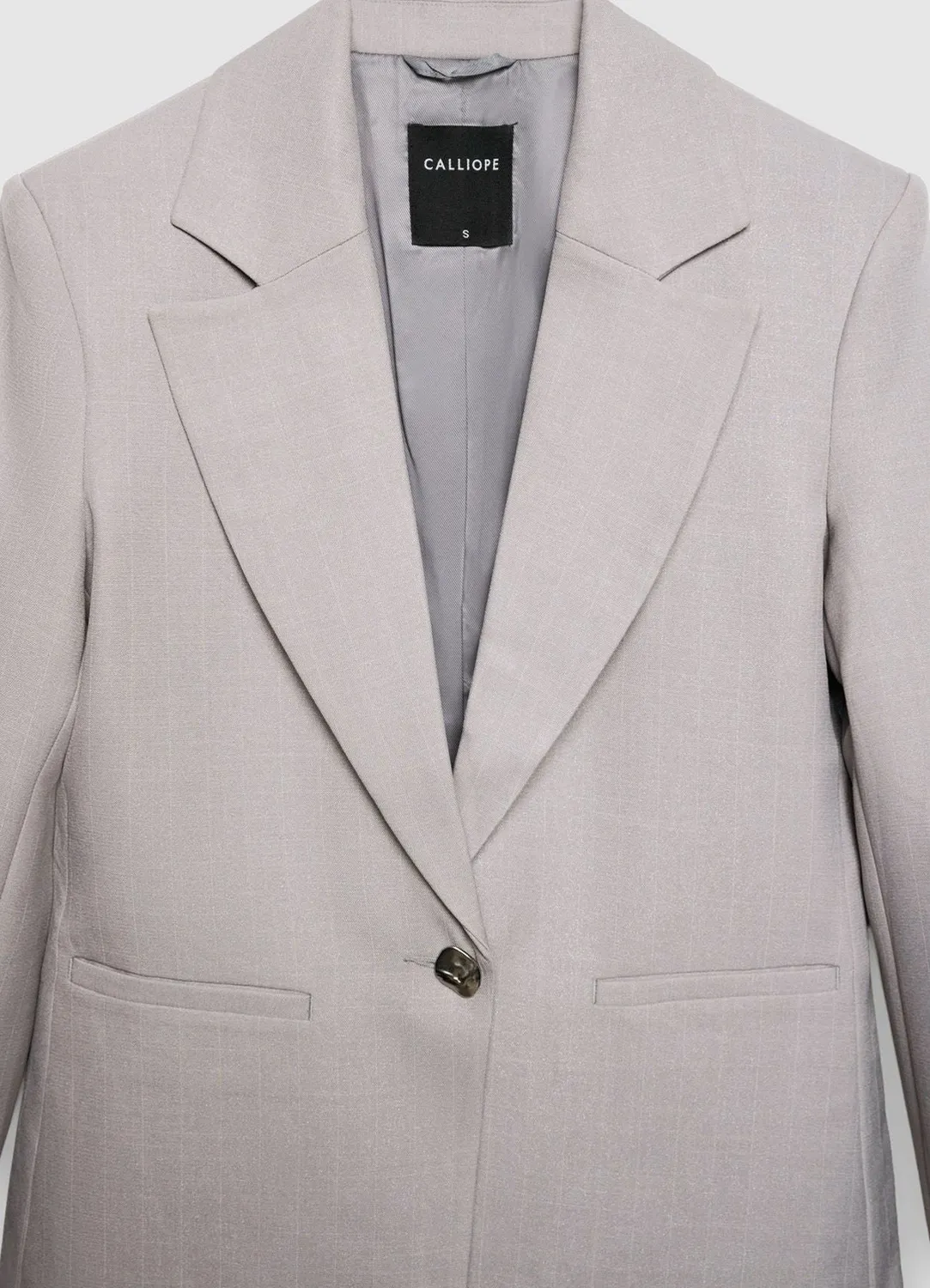 Calliope Gessata veste femme un bouton rayée