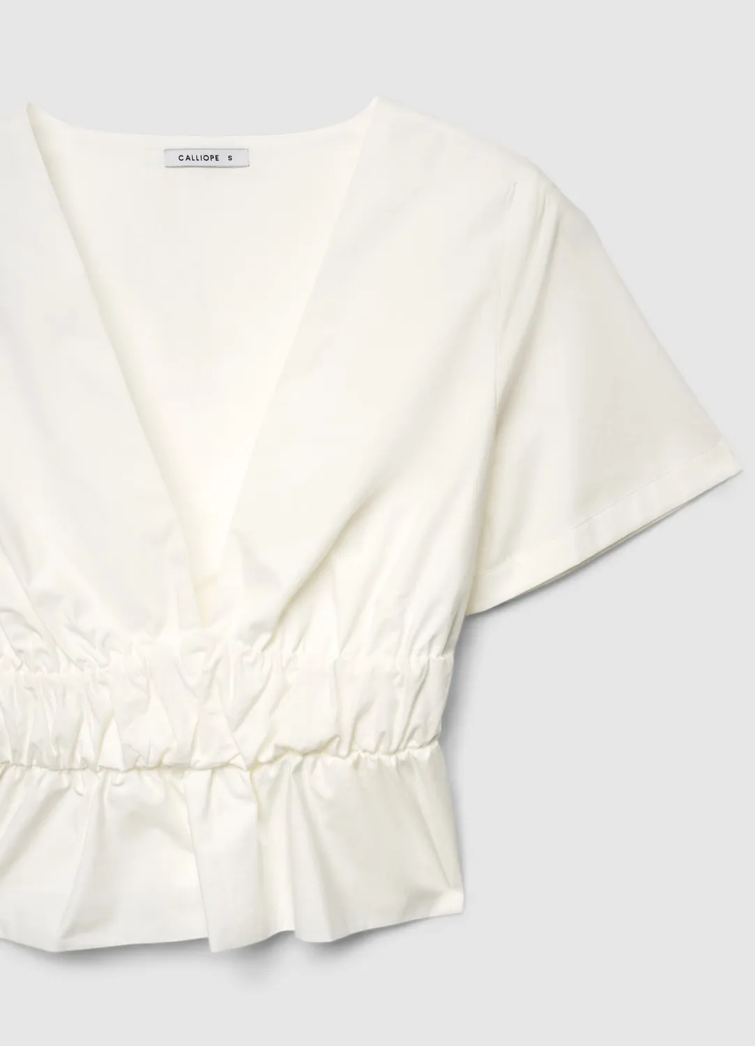 Calliope top peplum col V femme taille resserrée