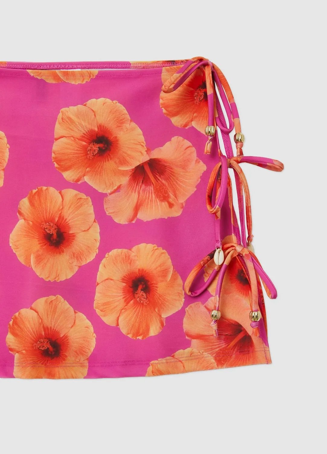 Calliope mini-jupe fleurs nouée plage femme