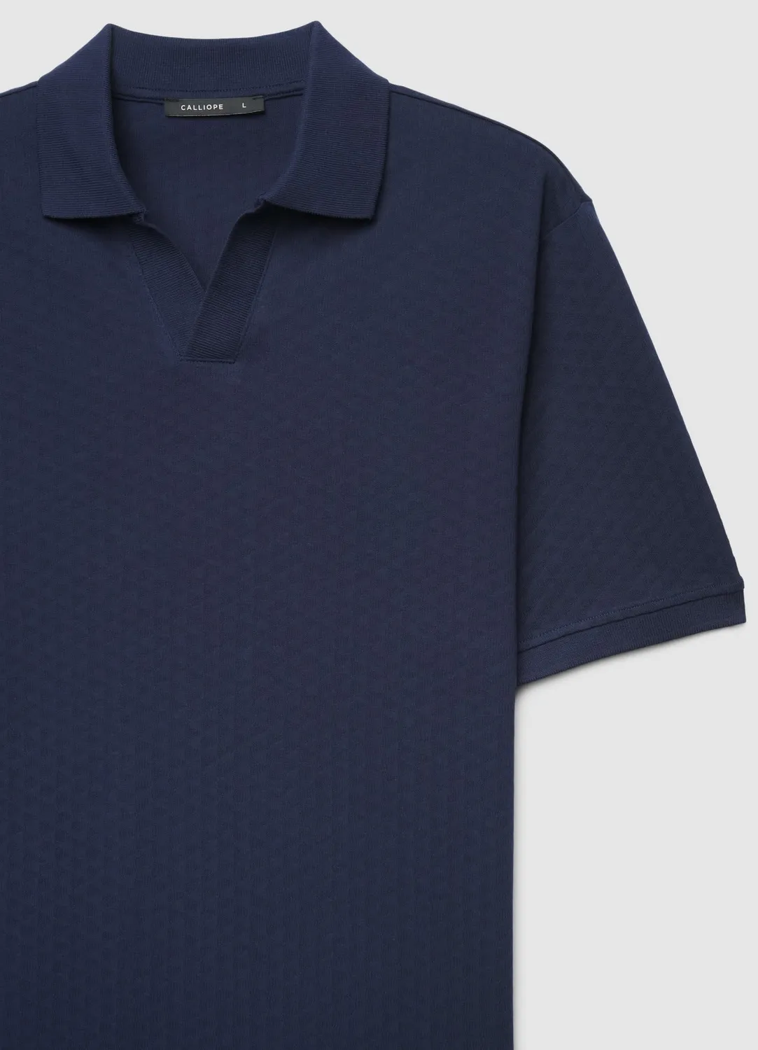 Calliope polo homme col ouvert jacquard uni