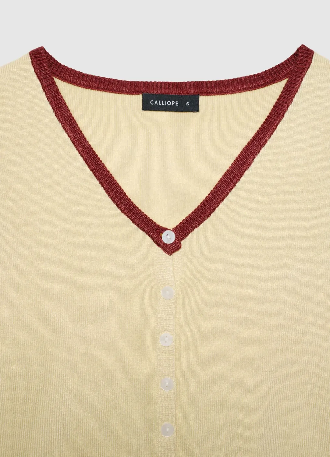 Calliope top boutons femme col V uni profil contraste