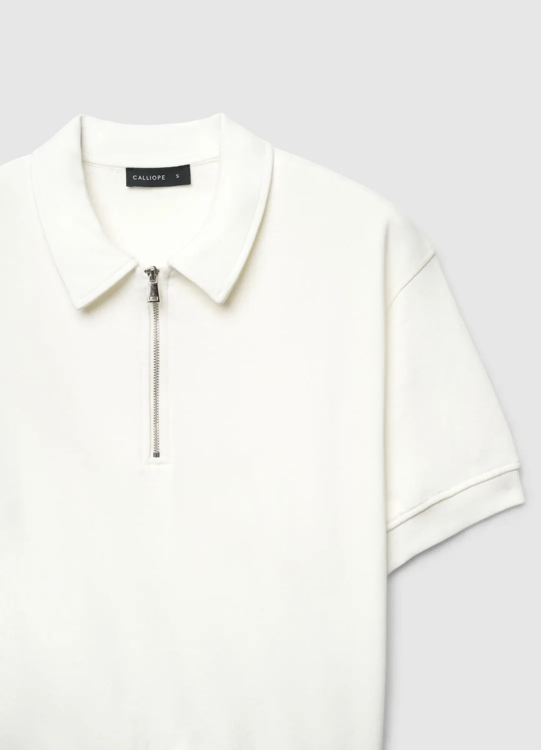 Calliope polo femme zippé manches courtes uni
