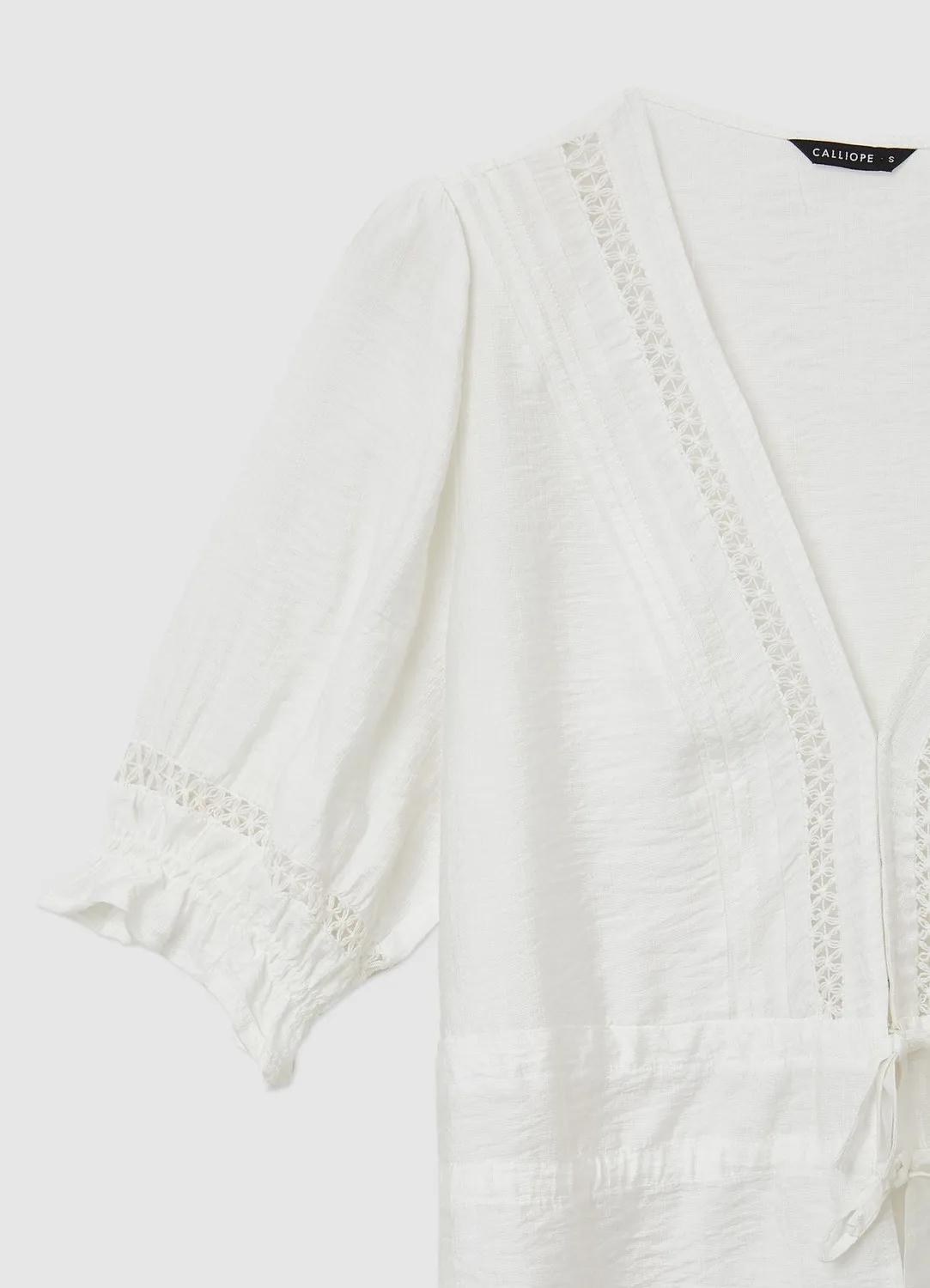 Calliope blouse broderie ajourée femme col V