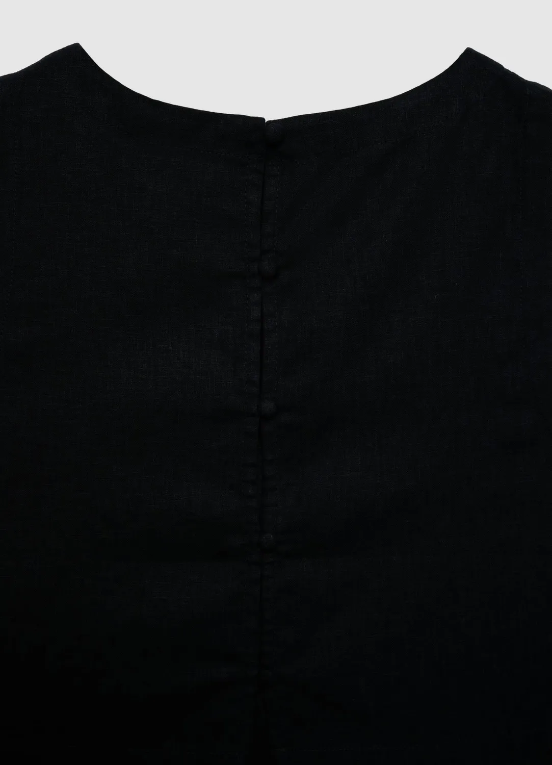 Calliope top court uni femme boutons dos