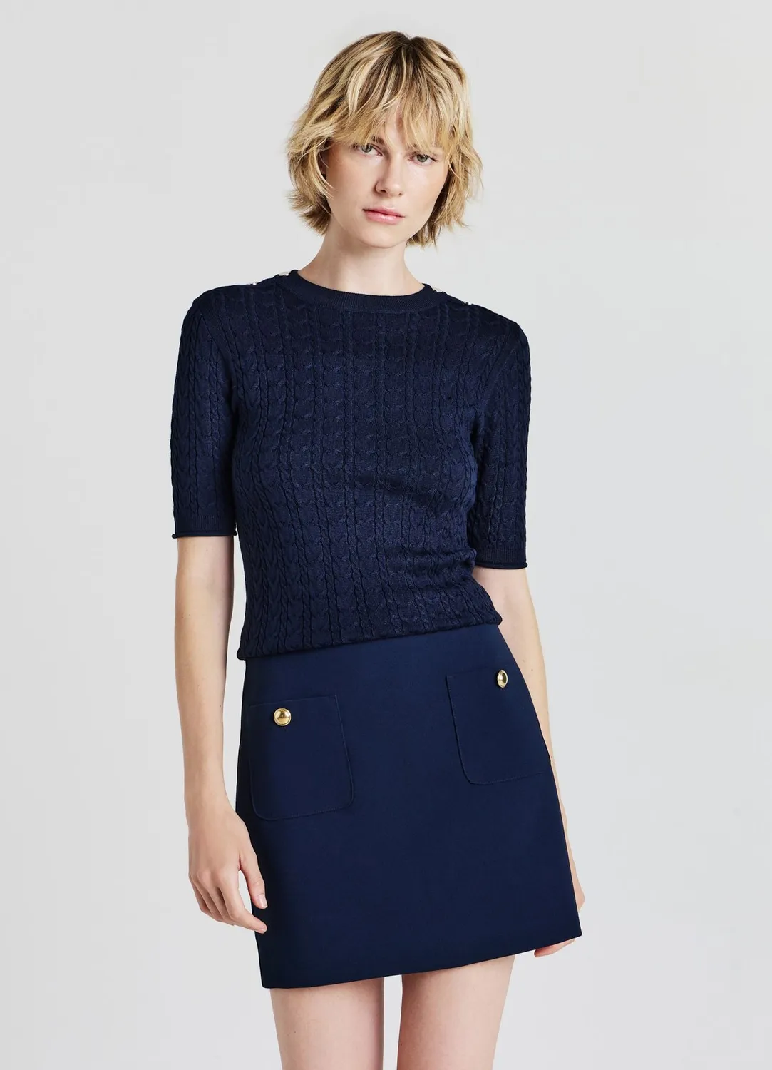 Calliope Minijupe femme poches boutons dorés