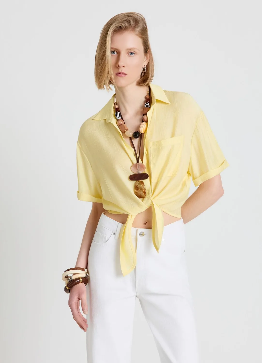 Calliope Chemise femme nouée unie manches courtes