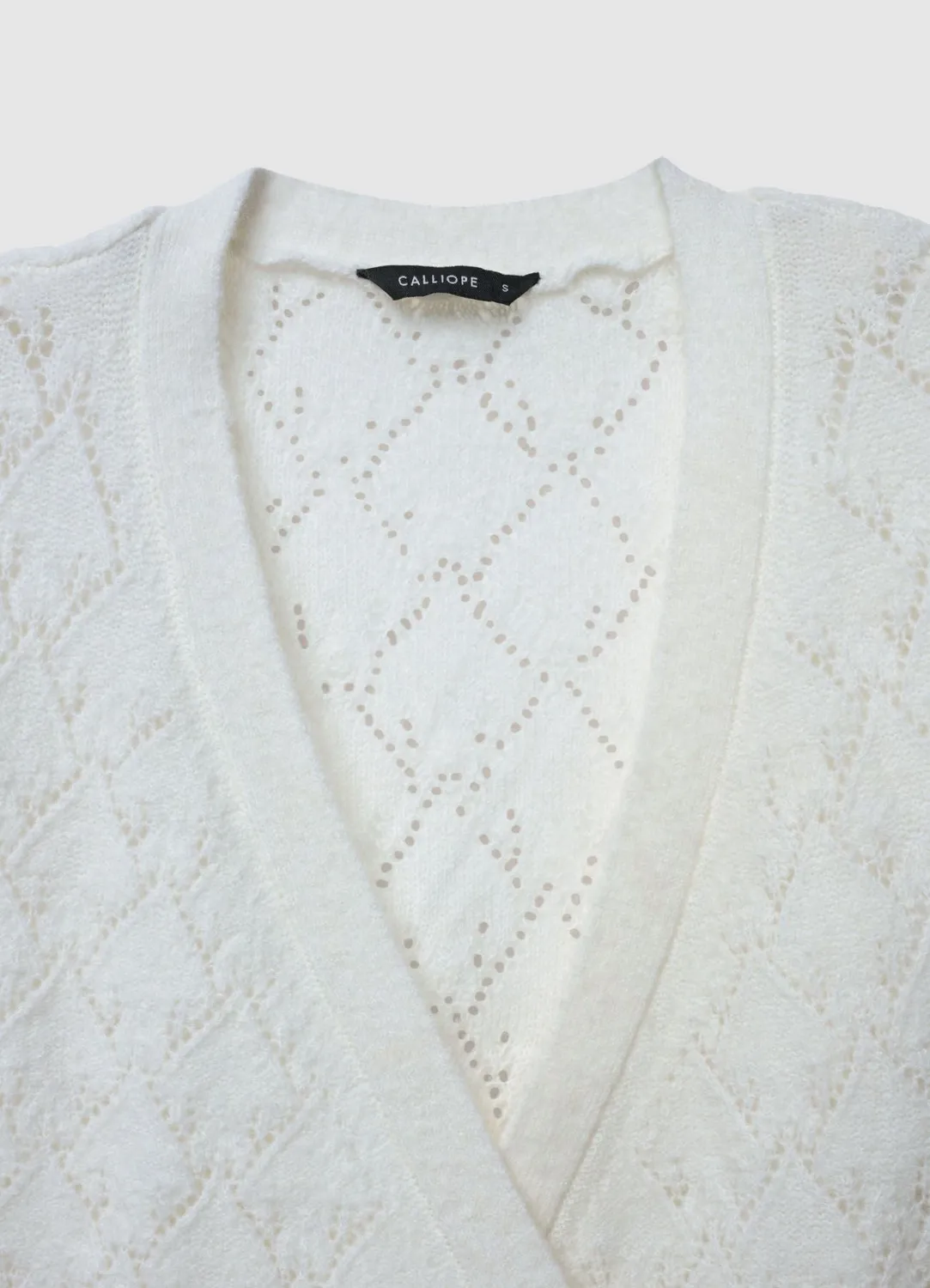 Calliope pull col V ajouré nœud femme manches longues