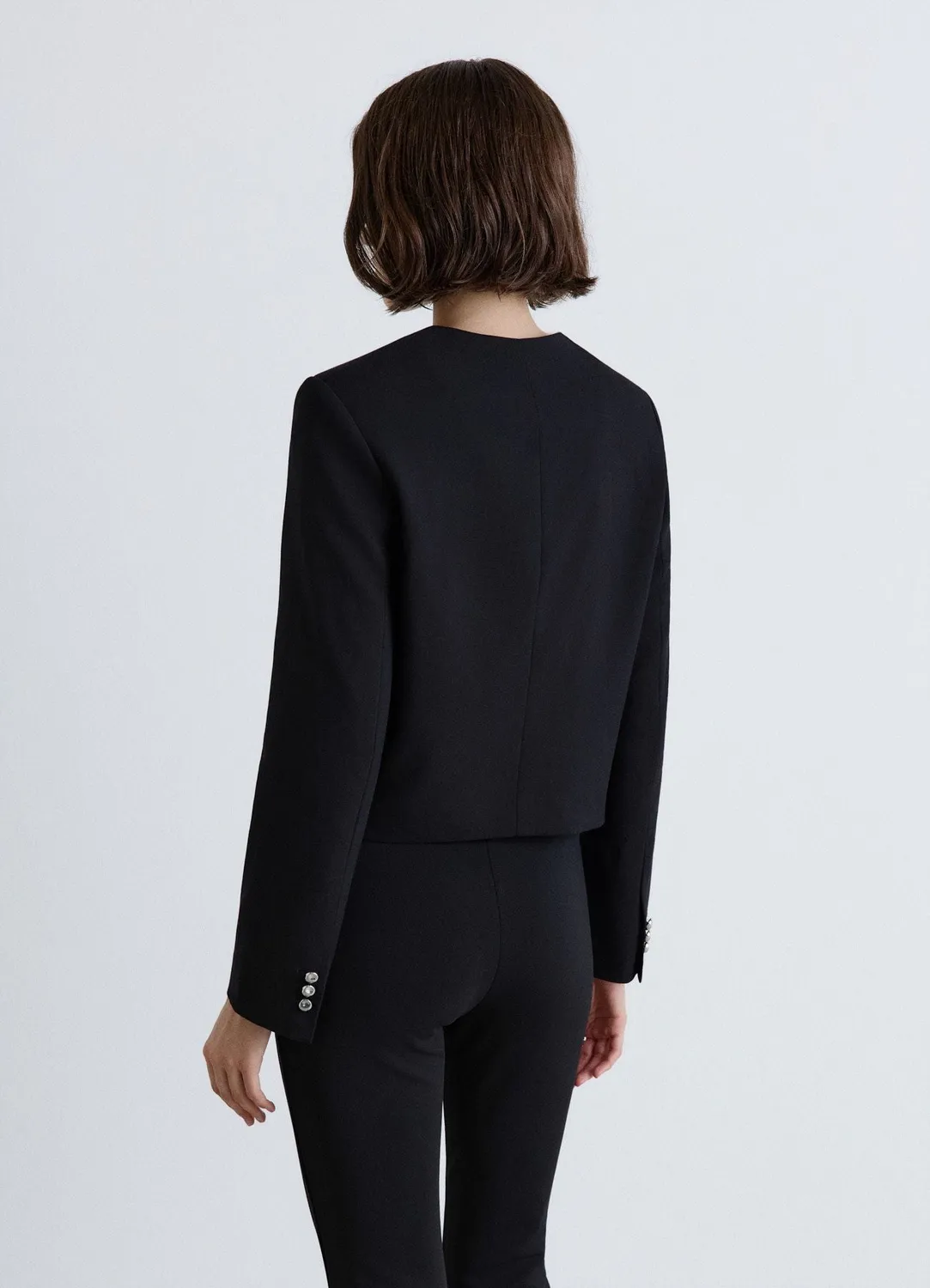 Calliope veste courte sans col boutonnée unie