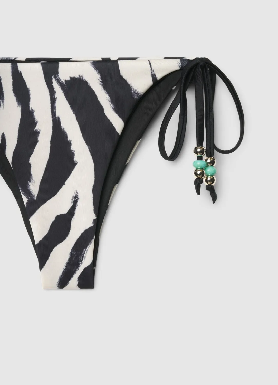Calliope slip bikini zèbre lacets coupe brésilienne