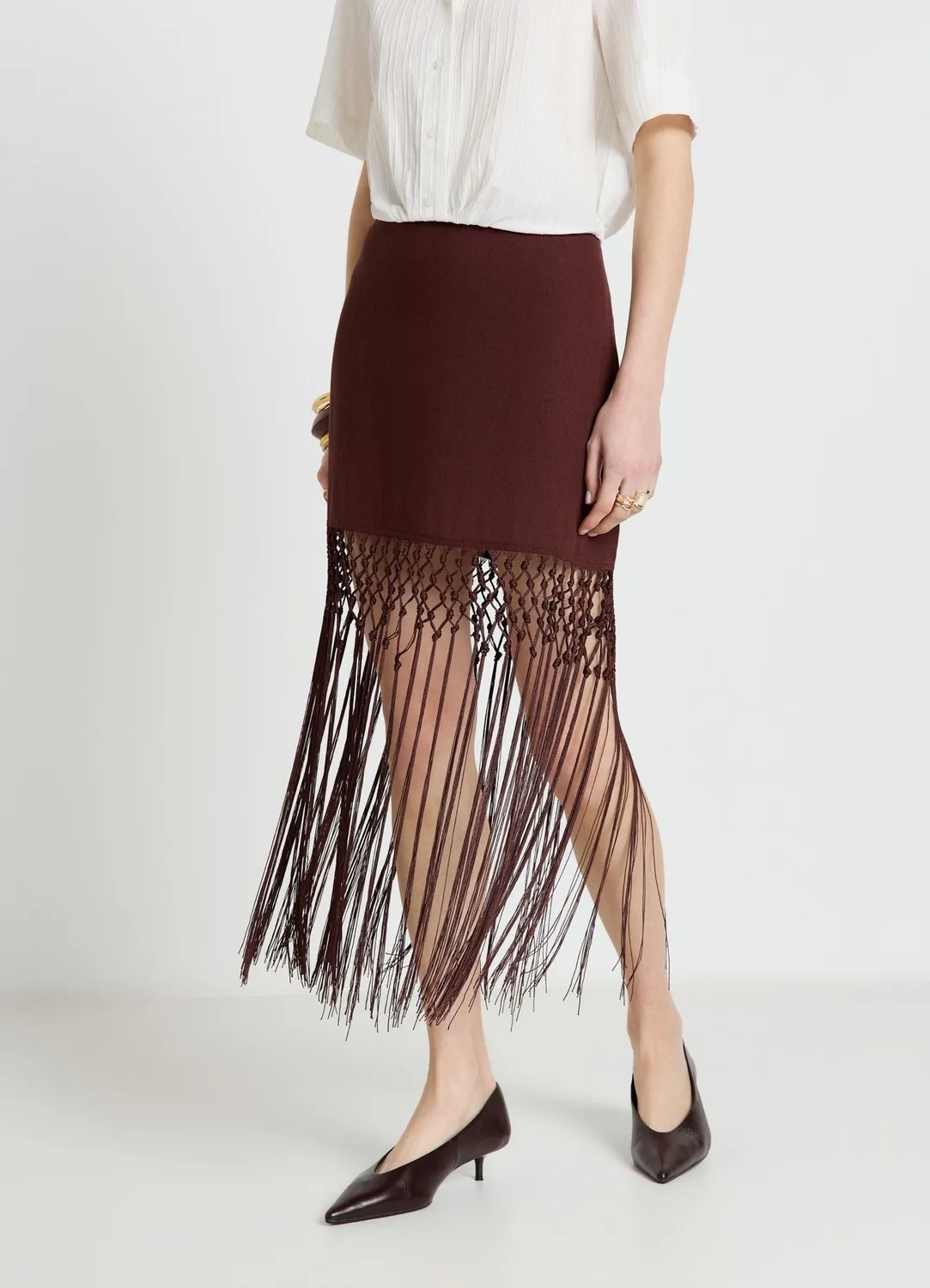 Calliope jupe mini unie à franges taille haute