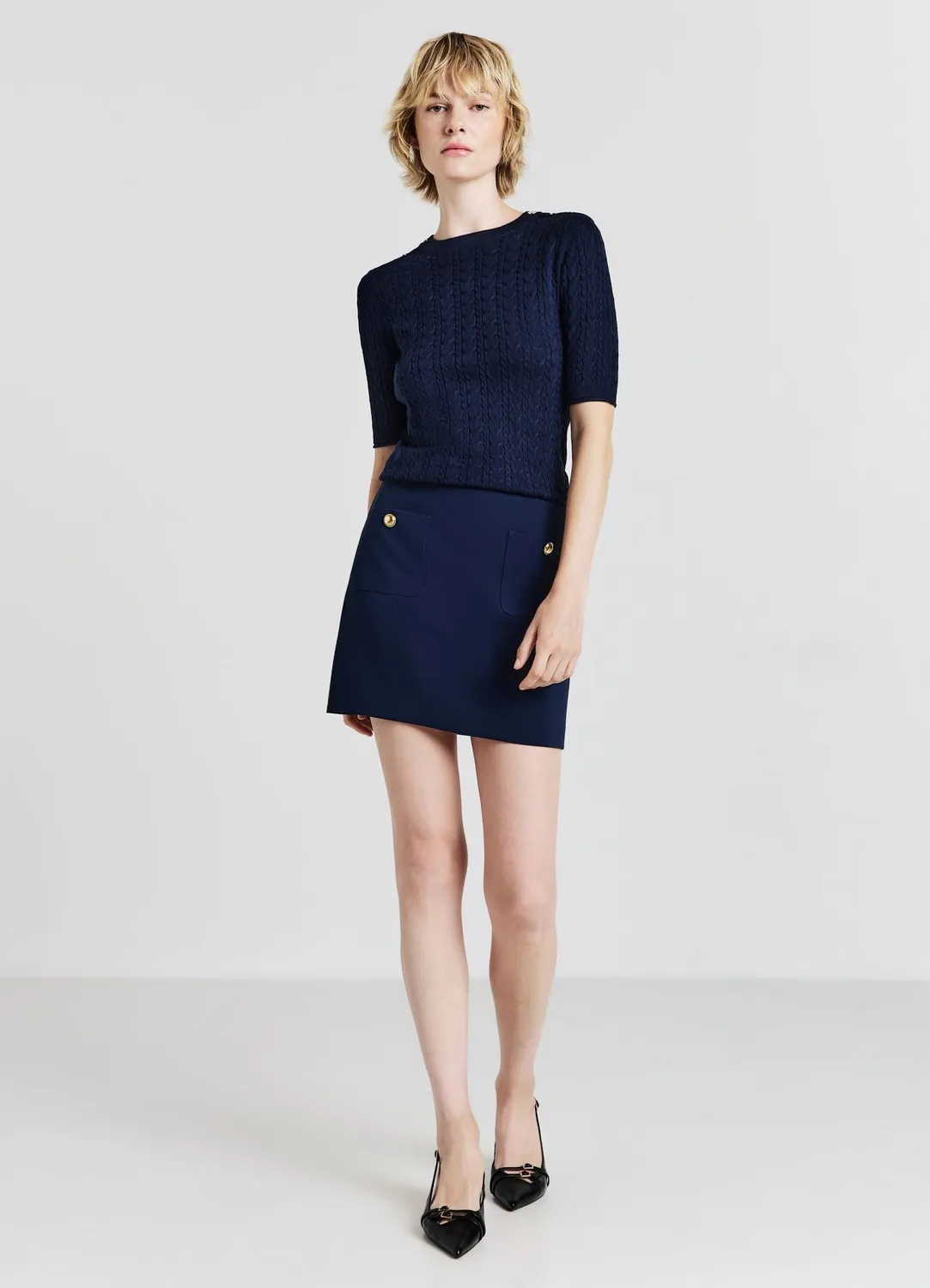 Calliope Minijupe femme poches boutons dorés