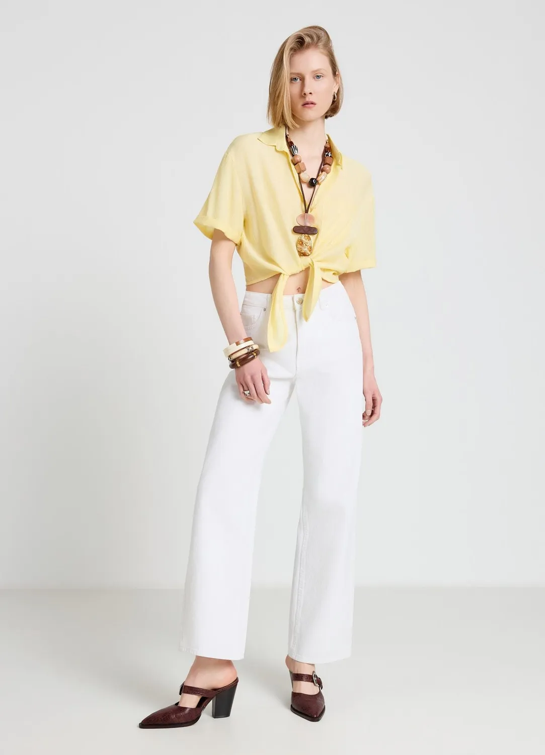 Calliope Chemise femme nouée unie manches courtes